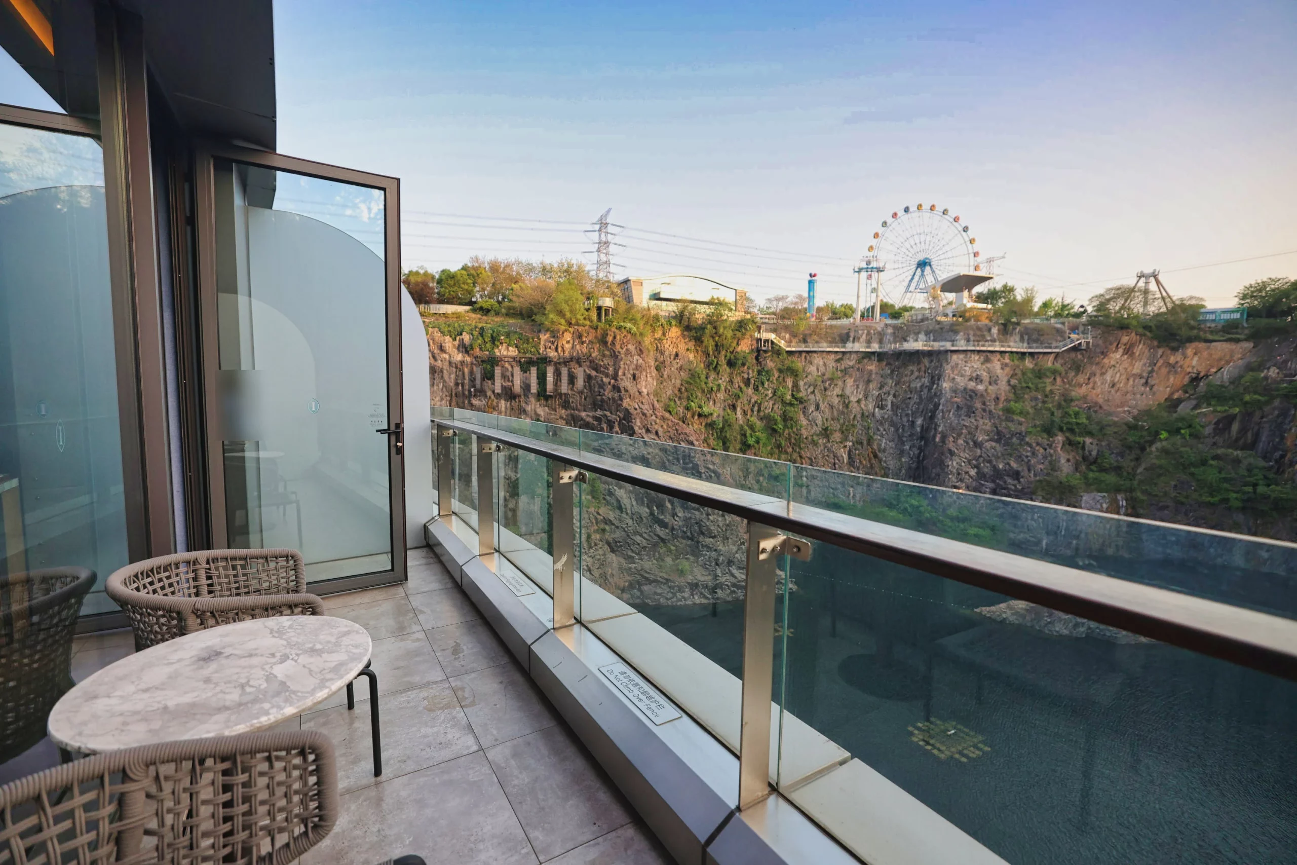 Relaxing outdoor seating area on a hotel room balcony.