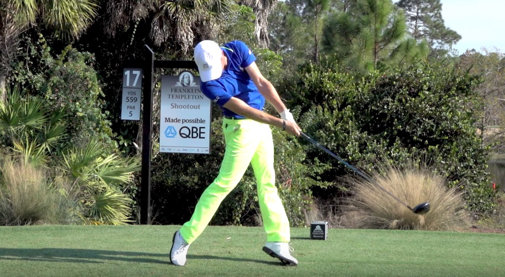 Jumping off the ground can be caused by too wide of a stance and lead foot position that is too closed at setup