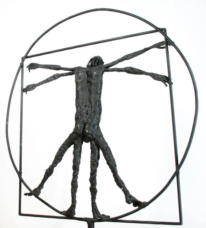 A steel human figure with repeated arms and legs inside a metal circle and square.