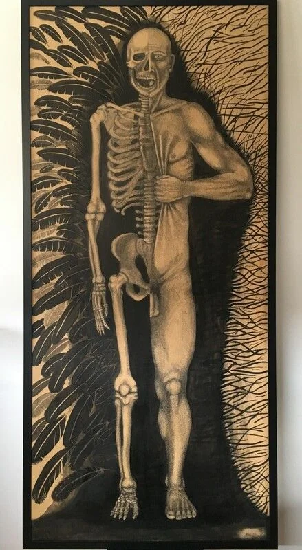 A large anatomical drawing showing a standing figure and skeleton against a dark ground.