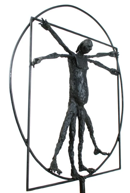 A steel human figure with repeated arms and legs inside a metal circle and square.