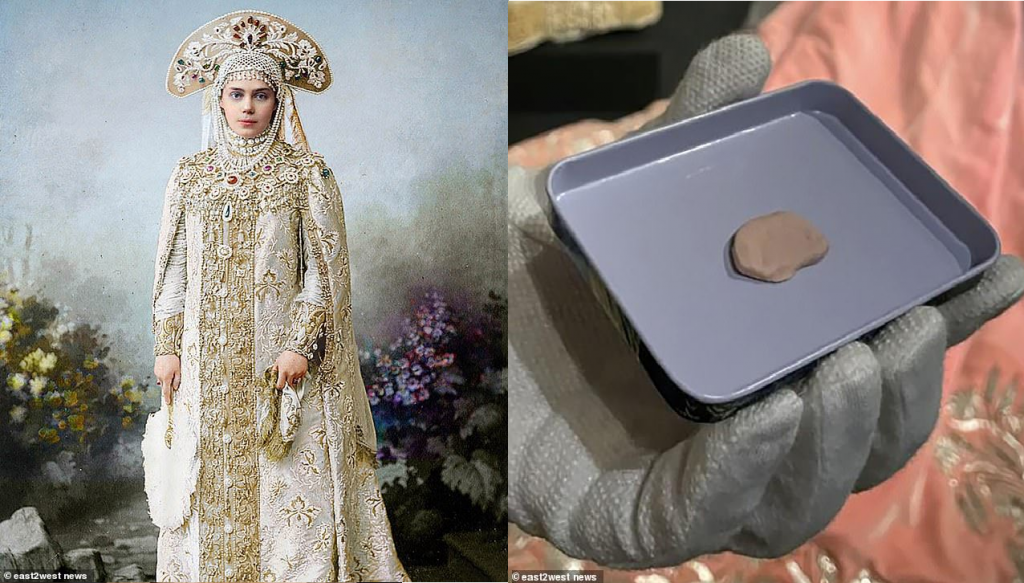 俄羅斯一名首席修復師在修復一件有118年歷史的禮服時，在袖子裡找到一顆鵝卵石大小的軟糖。（圖／翻攝自推特）