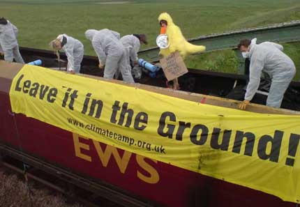 Coal protesters stop a train of the black stuff on its way to Drax, the UK's largest coal plant