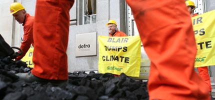 Greenpeace volunteers tip four tonnes of coal on government's doorstep