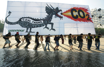 A banner at a protest organized for the largest coal industry gathering in Asia