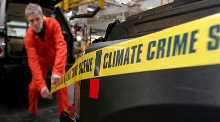 A Landrover is marked with CLIMATE CRIME SCENE tape