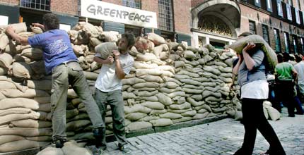 Activists and locals build a dyke around a government building in Groningen, Netherlands