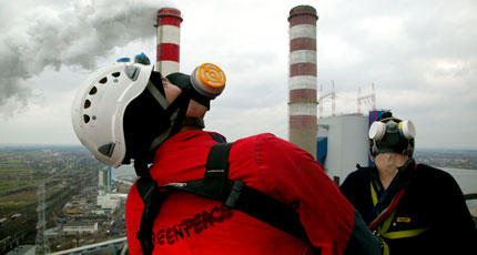 Greenpeace climbers make their way to the top of the Pątnów power coal fired power station chimney near Konin, western Poland. 