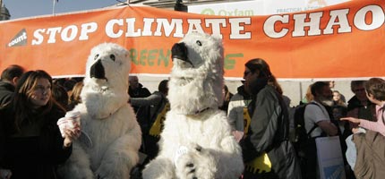 Climate change protesters dressed in polar bear costumes in Trafalgar Square, London