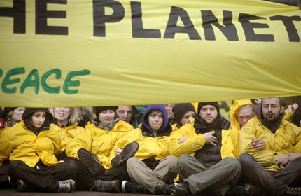 Greenpeace volunteers blockade a meeting of EU finance ministers in Brussels