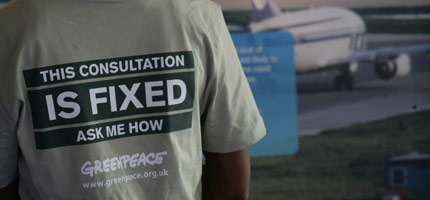 A Greenpeace volunteer at the Heathrow consultation exhibtion in London