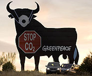 Activists from Greenpeace Spain climbed the Osborne Bull, an internationally known symbol of Spanish roads, to "protect" him from increasing CO2 emissions from cars