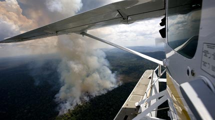 Flying over forest fires in the Amazon © Greenpeace/Beltra