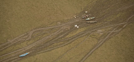 Canoes stranded on the Lago do Cristo Reis during one of the worst droughts ever recorded in the Amazon region