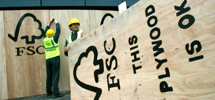 Activists demonstrate how the EU should be using FSC timber in May 2004 