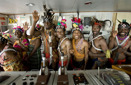 A dance troupe from Manokwari take a tour of the Esperanza's bridge
