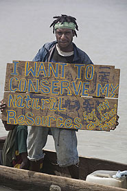 A Papuan campaigner protests about deforestation