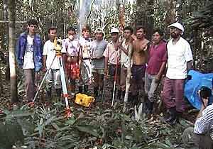 Deni and Greenpeace activists pose for a photo while working to protect the ancient forest from logging