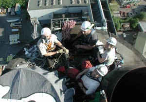 Sheffield incinerator: climbers on the chimney