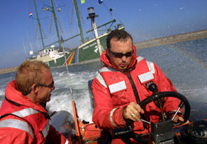 Jim Corr driving a Greenpeace inflatable in the Nu