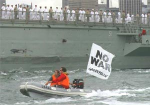 Australia: Greenpeace inflatable boat alongside HMAS Kanimbla protesting the deployment of troops to Iraq