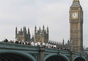 Greenpeace protesters walk over Westminster Bridge to join the start of the 'No War' march