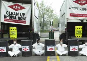 Activists block the entrance to Dow Center