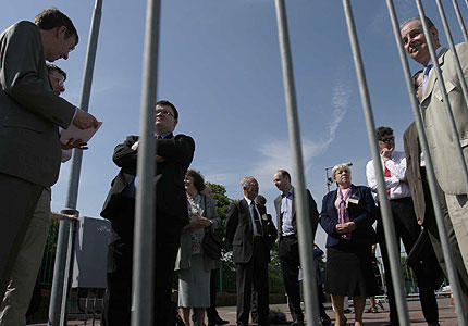 The delegation of church officials and MSPs wait in vain outside the gates of Aldermaston