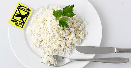 'Genetic engineering - hands off', the label says on a plate of rice contaminated with an illegal GM variety