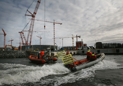 Greenpeace activists protest at the building site of a new reactor plant in Finland