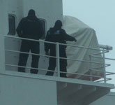 Armed policement on board the Pacific Pintail