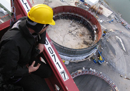 Climber looks down at the nuclear reactor core construction