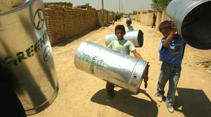 Exchanging radioactive barrels for clean water containers in Iraq