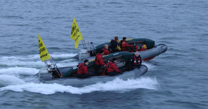 Activisits in dingies at the nuclear weapons submarine base in Faslane, Scotland