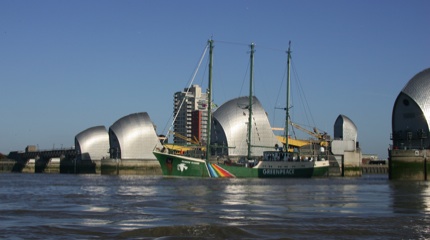 The Rainbow Warrior coming through the Thames Barrier 