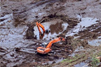 sunken digger in recently cleared and drained peatland by APP supplier PT Bina Duta Laksana, Riau province, Indonesia