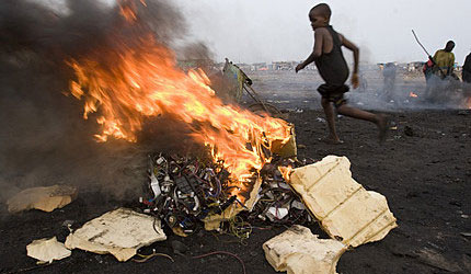 Ghana: boys burning electronic cables and other electrical components in order to melt off the plastic and reclaim the copper wiring. This burning in small fires releases toxic chemicals into the environment