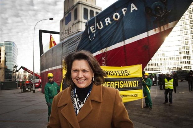 German agriculture minister Ilse Aigner walks past Greenpeace's trawler in Bruss