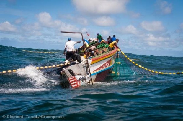 Senegalese fishermen in a traditional 'Pirogue' boat