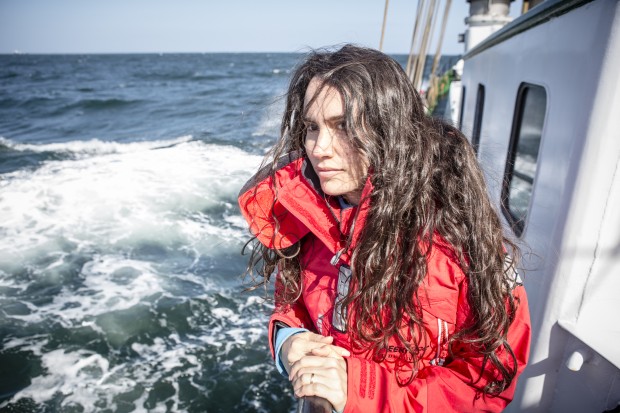 A picture of Marcela, member of GPUK oceans team, onboard the Beluga II boat 