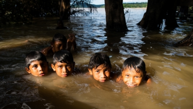 Children playing in river Tapajos