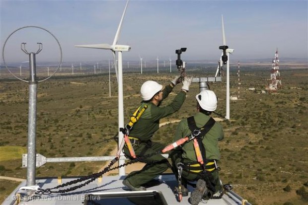 Technicians put up wind turbines in Spain