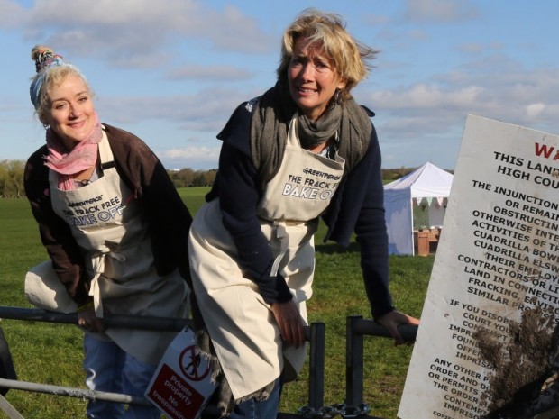 Emma and Sophie Thompson jump over a fence