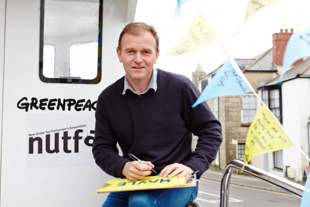 George Eustice signing a Greenpeace petition asking the Government to reallocate