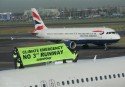 Greenpeace activists climb onto the top of a plane at London Heathrow Airport