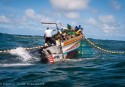 Senegalese fishermen in a traditional 'Pirogue' boat