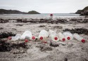 Picture of empty Coca-Cola bottles on a beach in Scotland