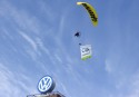 Paraglider with banner flying around VW headquarters