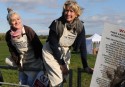 Emma and Sophie Thompson jump over a fence