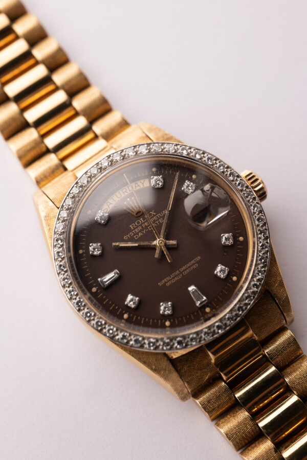 1972 Rolex 1803 Oxblood Diamond Dial w/ Florentine finish and Factory Diamond Bezel.